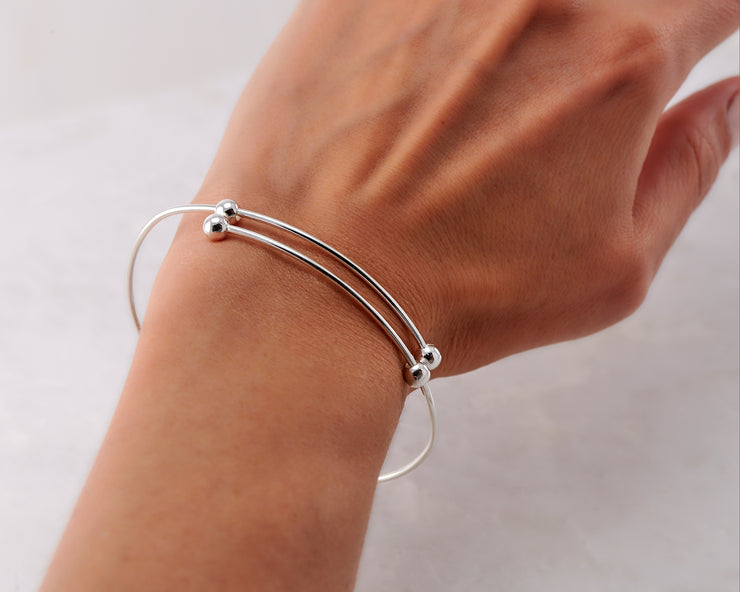 Woman wearing silver adjustable bracelet