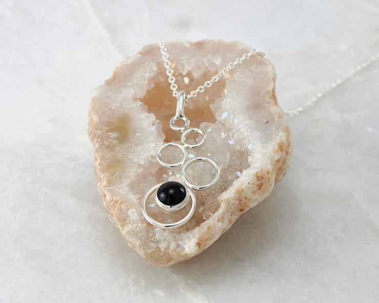 silver black onyx necklace on quartz
