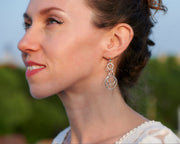 Woman wearing silver hammered circles earrings