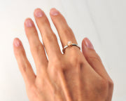 woman wearing moonstone engagement silver and gold ring