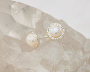 silver pearl stud earrings on crystal
