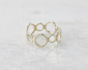 statement circles ring on white marble
