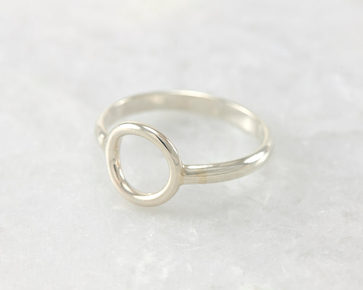 simple circle silver ring on white marble