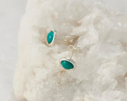 Silver dangle turquoise stud earrings on white rock