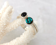 turquoise and black onyx ring on coral