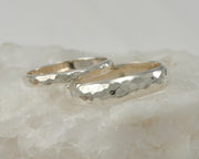 wedding ring set on white rock