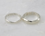 Two wedding bands showing custom engraving