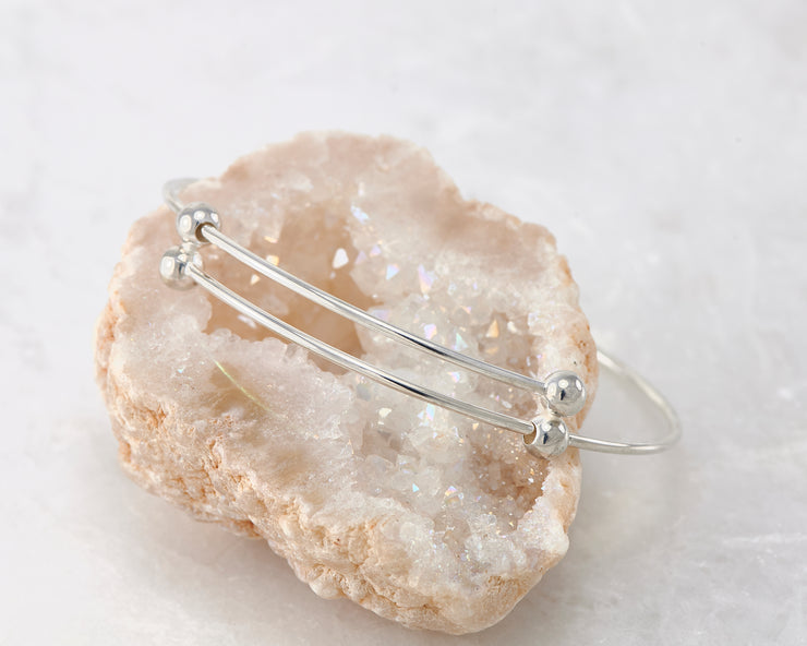 adjustable bangle bracelet shown on gypsum rock