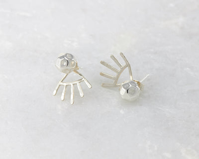 silver hammered ear jacket stud earrings on white marble