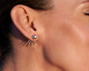 woman wearing silver ear jacket stud earrings