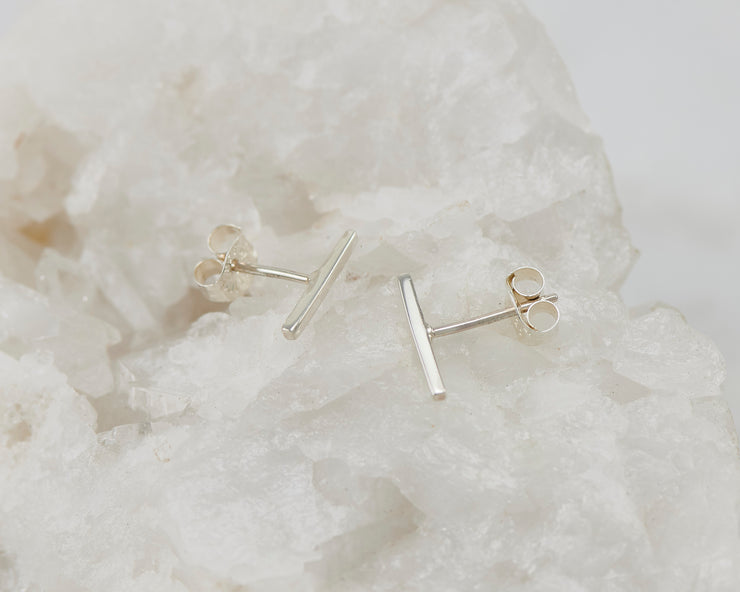 Simple Bar Stud Earrings on quartz