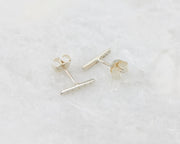Simple Bar Stud Earrings with Lines on marble