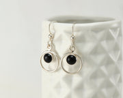 Silver black onyx earrings on geometric vase