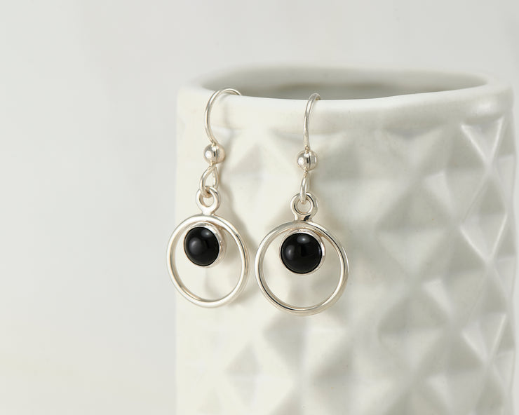 Silver black onyx earrings on geometric vase