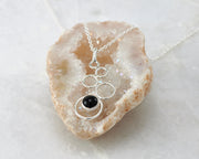 silver black onyx necklace on quartz