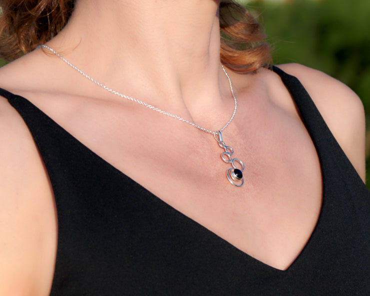 woman wearing a black onyx silver necklace