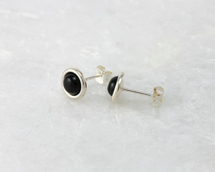 silver black onyx stud earrings on white marble