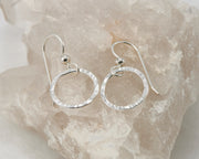 silver thread earrings on white crystal