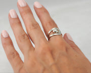 Woman wearing wrap modern ring