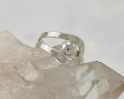 Silver wrap ring on crystal rock