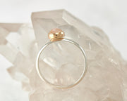 silver and gold moonstone engagement ring on crystal rock