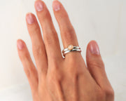 woman wearing moonstone engagement ring & matching wedding ring