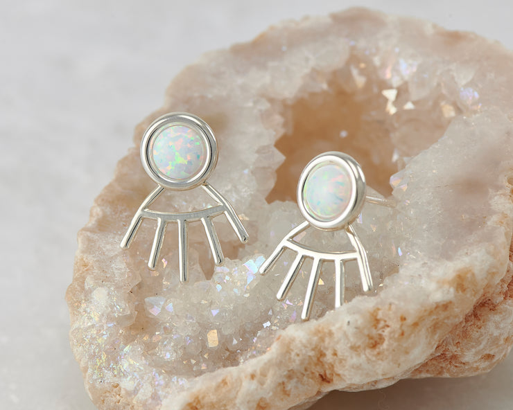 silver opal stud earrings on quartz