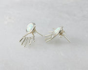 silver opal ear jacket stud earrings on white marble