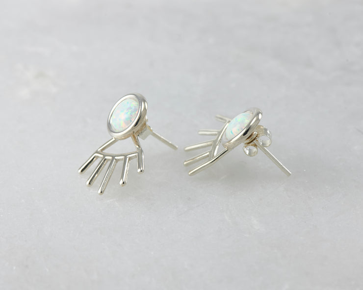 silver opal ear jacket stud earrings on white marble