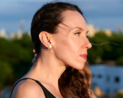 woman wearing silver opal ear jacket stud earrings