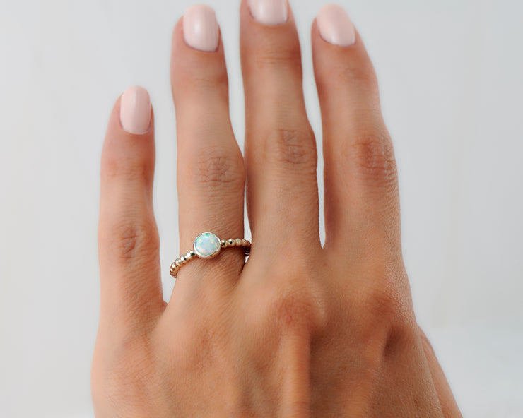 Woman wearing beaded opal ring