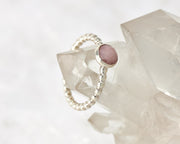 Silver beaded ring on crystal rock