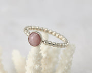 Silver peruvian pink opal ring on coral