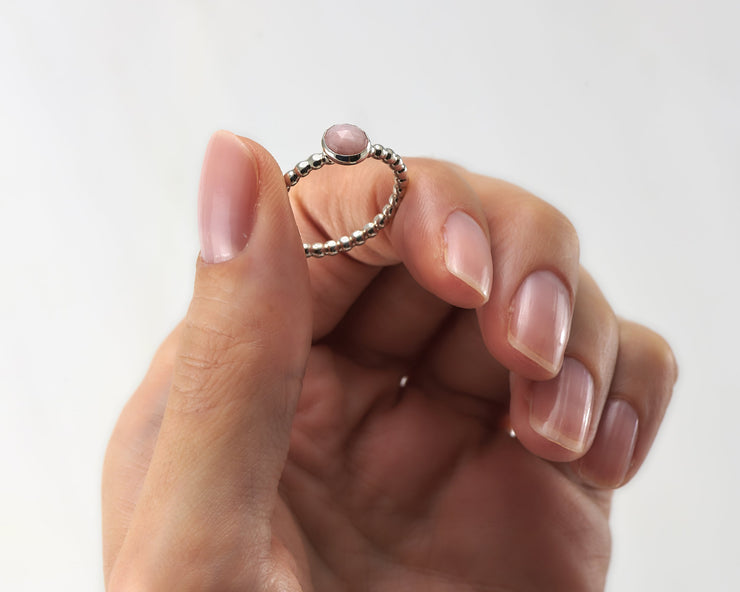 Woman holding peruvian pink opal silver ring