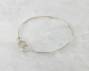 bangle charms silver bracelet on marble
