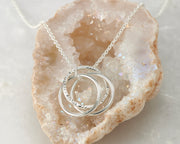 interlokcing unity necklace on quartz