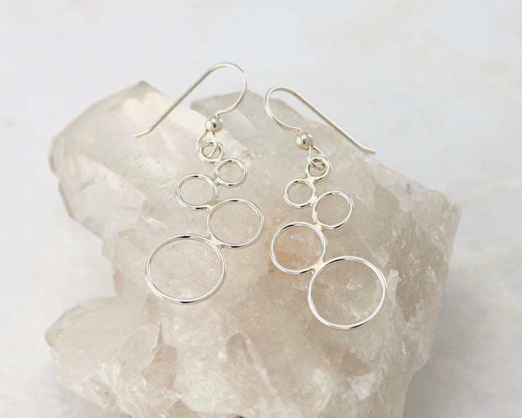 Silver circles chandelier earrings on crystal rock