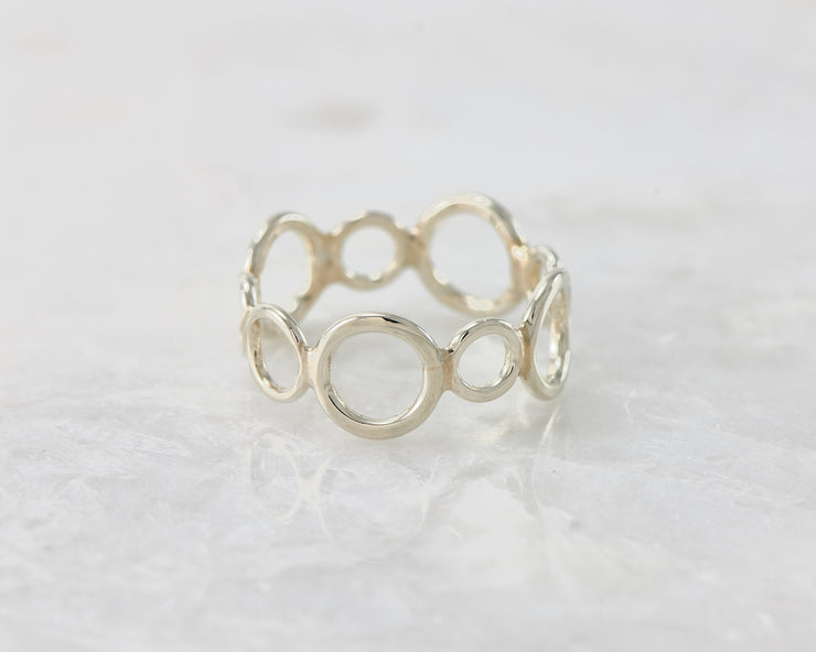 statement circles ring on white marble