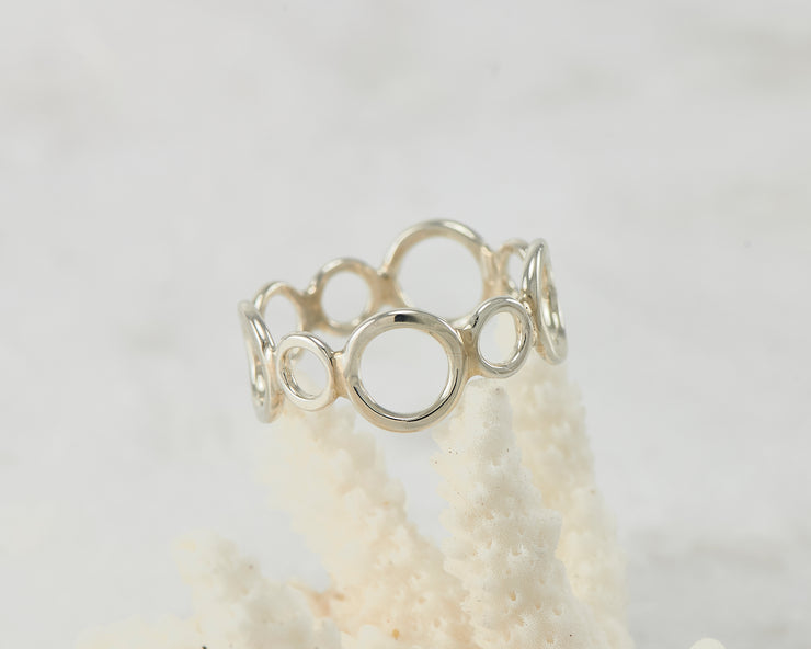 circles silver statement ring on coral