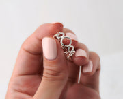 Woman holding circles silver ring