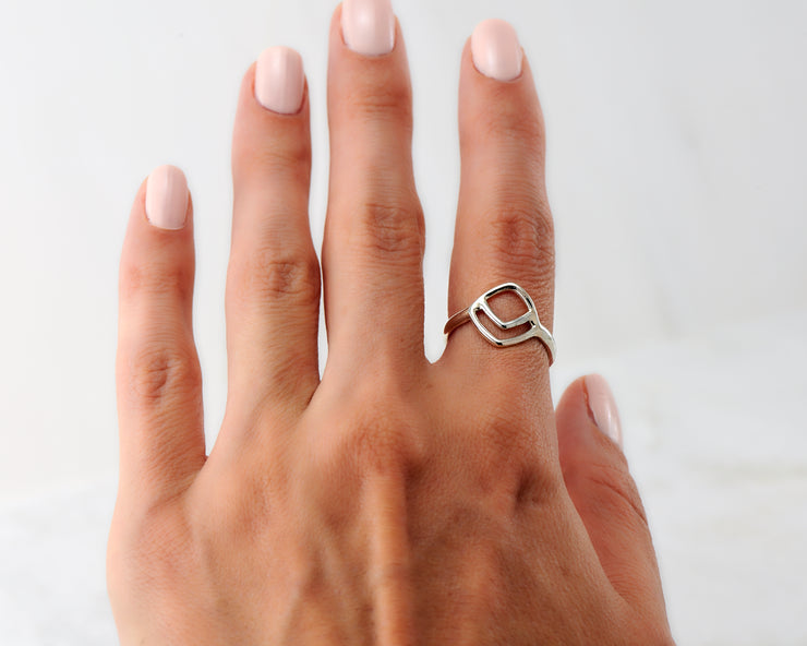 Woman wearing chevron geometric ring