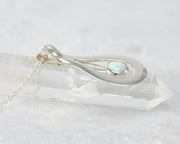 Silver opal pendant on crystal 
