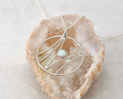 silver opal necklace on quartz