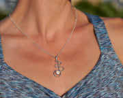 Woman wearing silver opal necklace