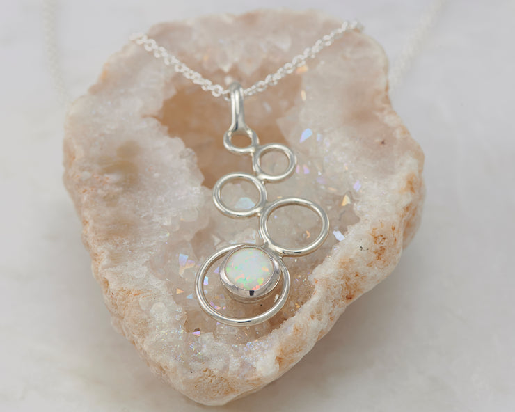 silver opal necklace on quartz