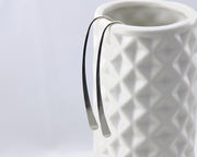 Open Hoop Dangle Earrings on geometric vase