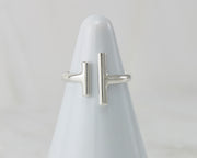 White ring holder with Silver ring