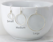 silver hoop earrings in small, medium, and large