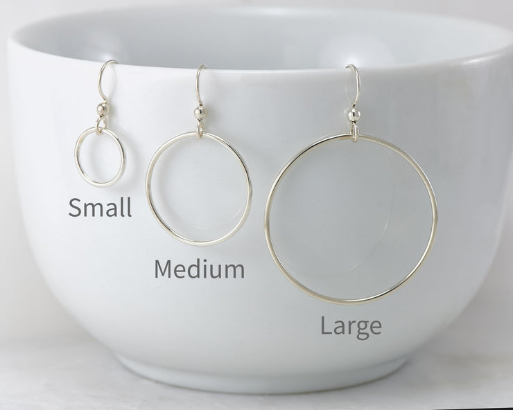 silver hoop earrings in small, medium, and large