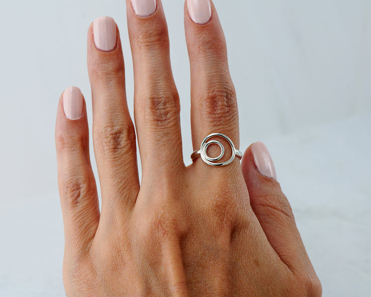 woman wearing silver circles ring